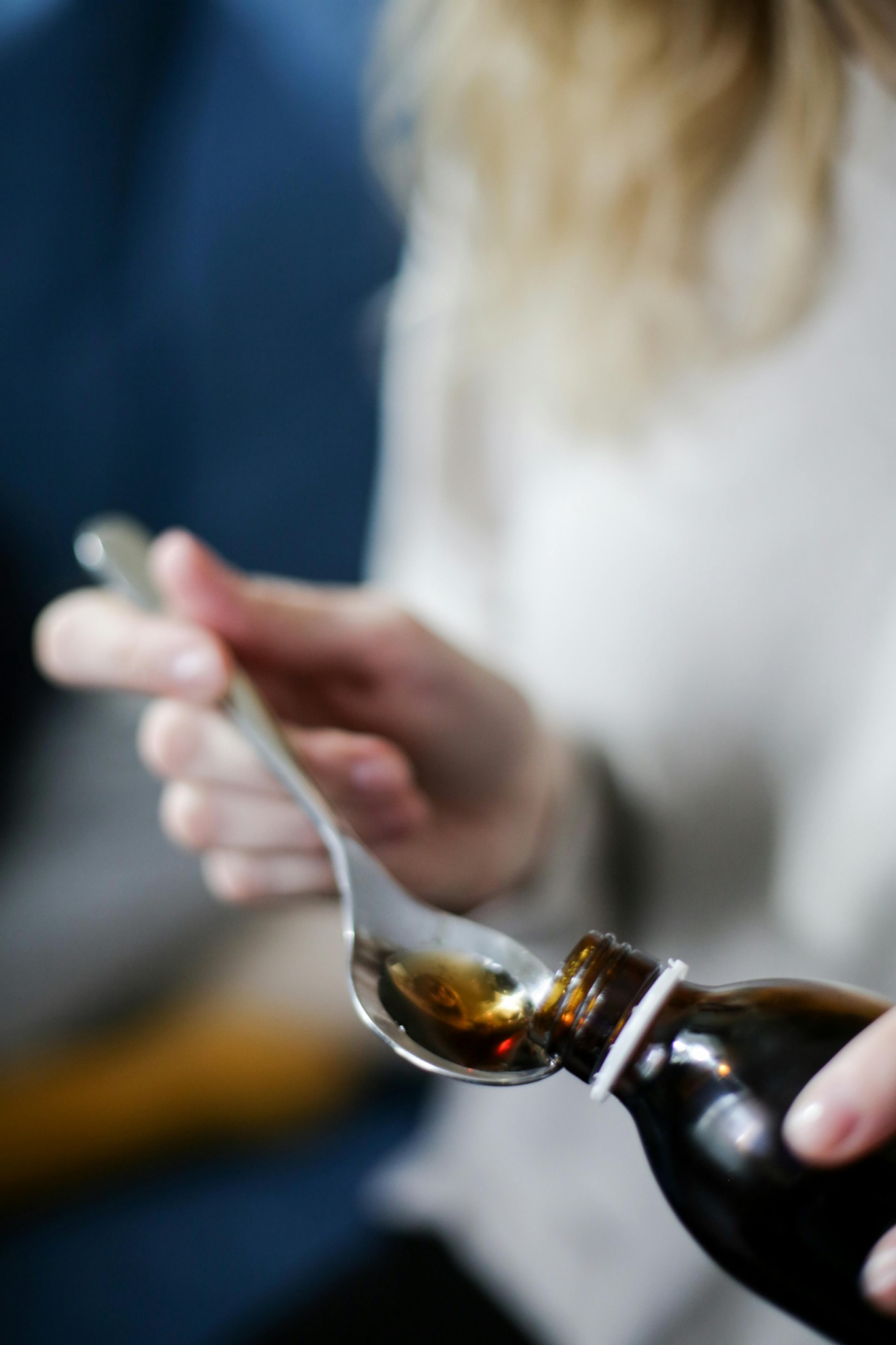Wellness syrup with measuring spoon